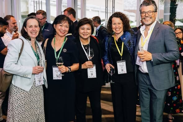 Participants posing at an Australian AI Innovators Mission event in Singapore.